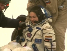 Space Station Crew Returns to Earth, Lands Safely in Kazakhstan 4 Her first mission to the space station, Expedition 42 flight engineer Elena Serova of the Russian Federal Space Agency is assisted in her exit from the Soyuz that returned her and her team members from the ISS. Image Credit: NASA