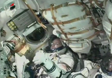 Year in Space Starts for One American and One Russian 3 NASA astronaut Scott Kelly gives a thumbs-up from inside the Soyuz TMA-16M taking him and Expedition 43 crewmates Mikhail Kornienko, and Gennady Padalka of the Russian Federal Space Agency (Roscosmos) to the International Space Station after a successful launch from the Baikonur Cosmodrome in Kazakhstan. Image Credit: NASA