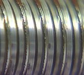 Science of friction: Kipping things moving in space 3 Worn screw