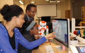 A student works in the Choreographe visual programming environment used to program humanoid robots.