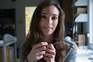 Rice University research scientist Francesca Mirri holds a standard coaxial data cable (bottom) and a new cable with an outer conductor of carbon nanotubes. Source: Jeff Fitlow/Rice University