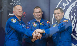 Launch, Docking Returns International Space Station Crew to Full Strength 3 Expedition 47 crew members Flight Engineer Jeff Williams of NASA, Soyuz Commander Alexey Ovchinin of the Russian space agency Roscosmos, and Flight Engineer Oleg Skripochka of Roscosmos pose for a photo at the conclusion of a press conference on Thursday, March 17, 2016, at the Cosmonaut Hotel in Baikonur, Kazakhstan. Credits: NASA/Aubrey Gemignani