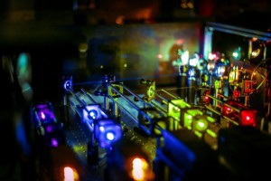 MIT scientists developed a super-resolution imaging technique, using a combination of multi-colored lasers and mirrors, to visualize very tiny, transient phenomena, such as enzyme clustering on genes.  Photo: Jose-Luis Olivares/MIT