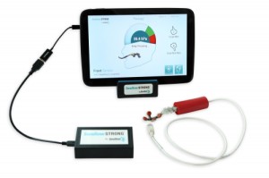 A sensor (lower right) in the SwallowSTRONG device connects to a tablet computer that encourages patients and records results. PHOTO COURTESY OF SWALLOW SOLUTIONS