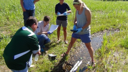 Students test the contents of a stream at the Notre Dame Linked Experimental Ecosystem Facility. Rice University scientists will bring the light transmission spectrometer into the field under natural conditions as part of the device's testing.