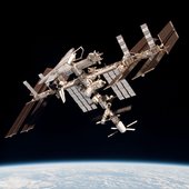 The International Space Station with ATV 2 and Endeavour small