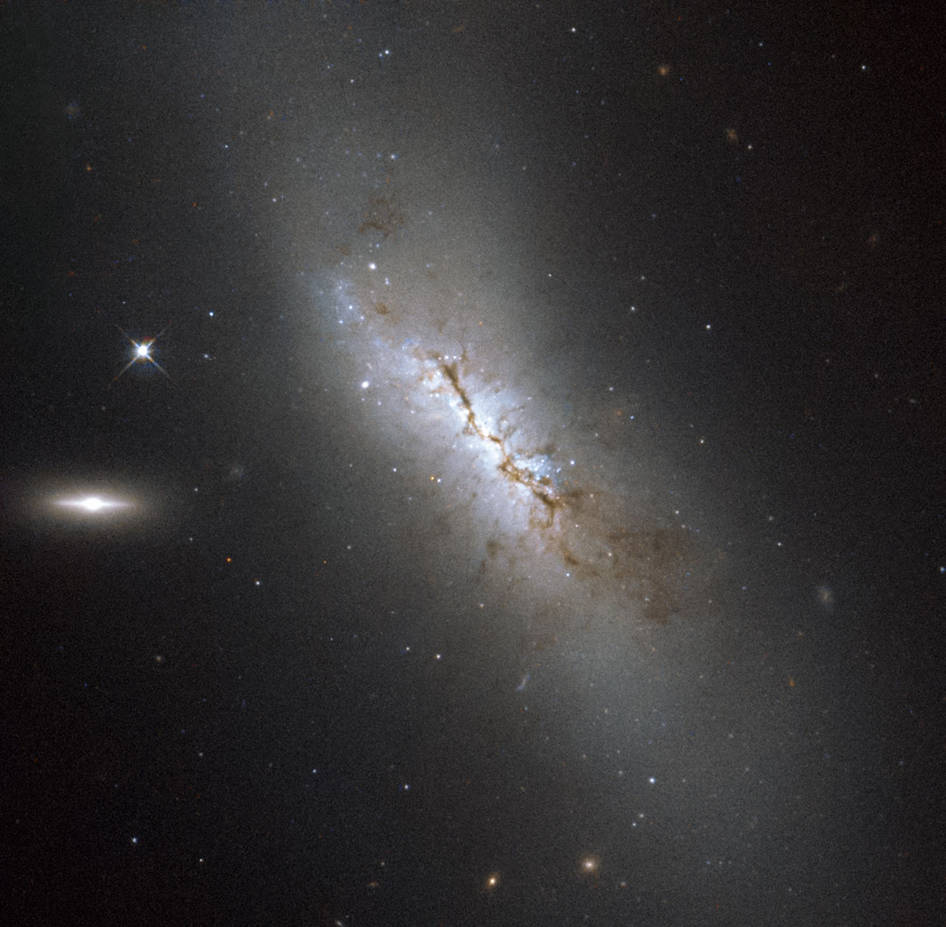 Hubble Images a Dusty Galaxy,…